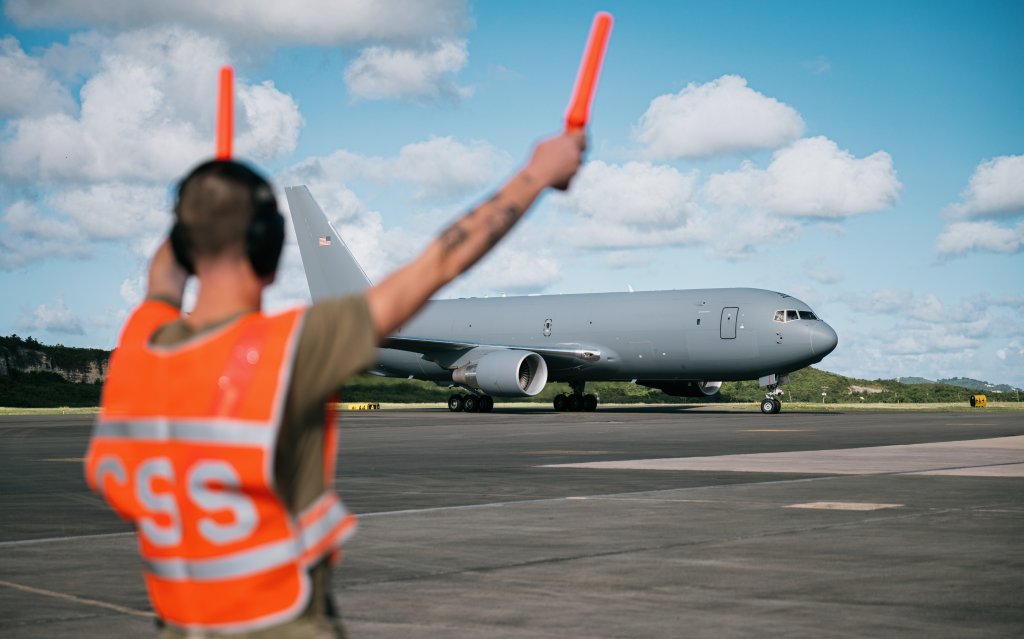 A U.S. Air Force airfield manager assigned to the 6th Expeditionary Air Refueling Squadron marshals a KC-46A Pegasus on the flight line in Frederiksted, St. Croix, Oct. 29, 2025. U.S. military forces are deployed to the Caribbean in support of the U.S. Southern Command mission, Department of War-directed operations, and the president’s priorities to disrupt illicit drug trafficking and protect the homeland. (U.S. Air Force photo)