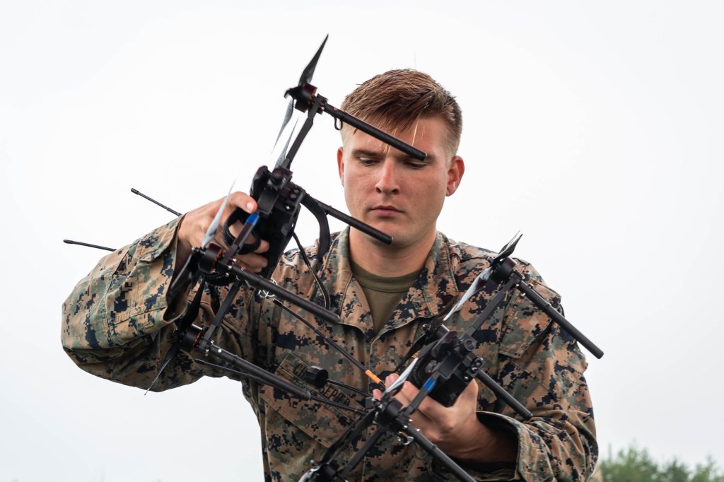 The Marine Corps Attack Drone Team, Weapons Training Battalion – Quantico, in coordination with Training and Education Command and the Marine Corps Warfighting Laboratory, hosted senior U.S. Marine Corps leaders and members of the Marine Gunner Symposium for a weapons demonstration at Marine Corps Base Quantico, Va., Aug. 20, 2025. U.S. Marine Corps Lt. Gen. Jerry Carter, deputy commandant for information, Headquarters Marine Corps, attended the event, which showcased First-Person View attack drone mission profiles, AI-enabled autonomous strikes, and counter-drone training to highlight their role as a critical force multiplier for the Fleet Marine Force and advance the Secretary of Defense’s drone dominance initiative. (U.S. Marine Corps photo by Connor Taggart)